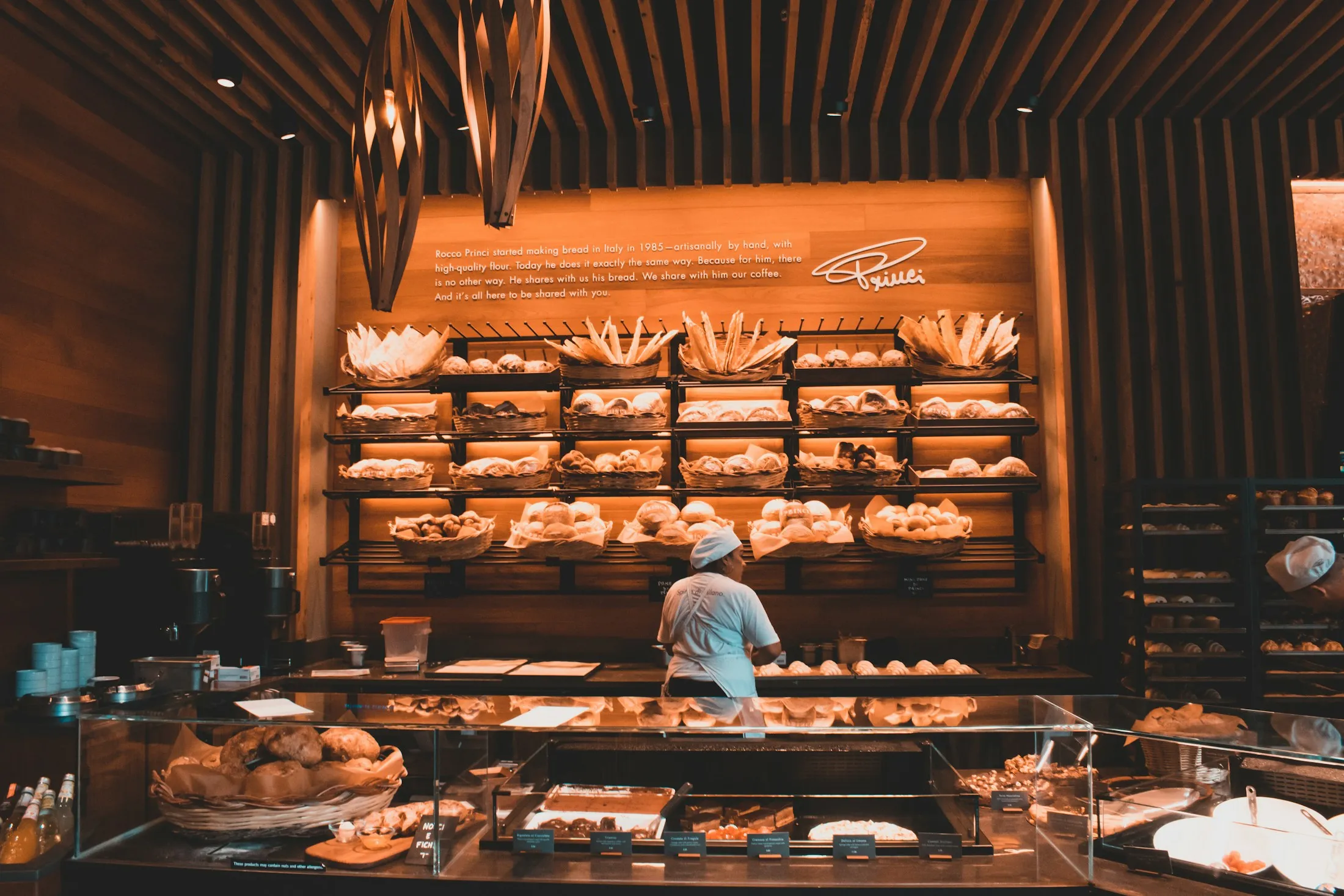 Inside the bakery, shelves full of fresh bread